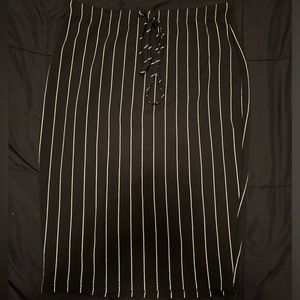 Knee length black skirt with white stripes